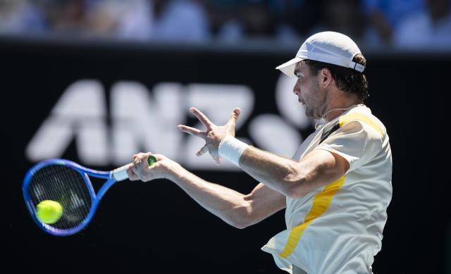(260121) -- MELBOURNE, Jan. 21, 2026 (Xinhua) -- Jaime Faria of Portugal hits a return during the men's singles 2nd round match against Andrey Rublev of Russia at the Australian Open tennis tournament in Melbourne, Australia, Jan. 21, 2026 (Photo by Hu Jingchen/Xinhua)
