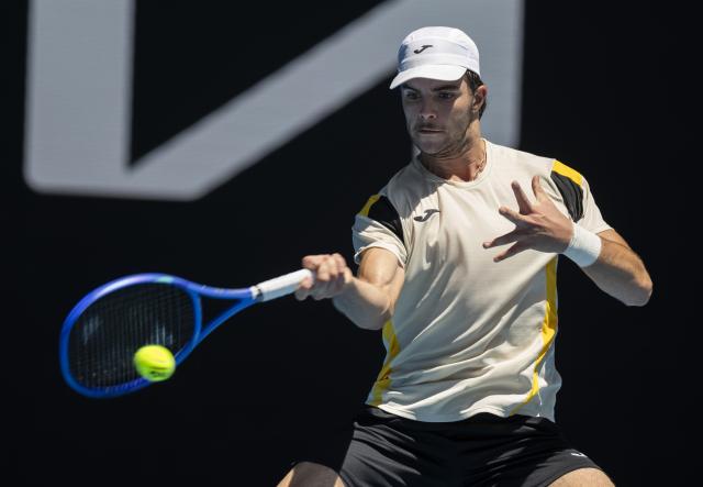 (260121) -- MELBOURNE, Jan. 21, 2026 (Xinhua) -- Jaime Faria of Portugal hits a return during the men's singles 2nd round match against Andrey Rublev of Russia at the Australian Open tennis tournament in Melbourne, Australia, Jan. 21, 2026 (Photo by Hu Jingchen/Xinhua)