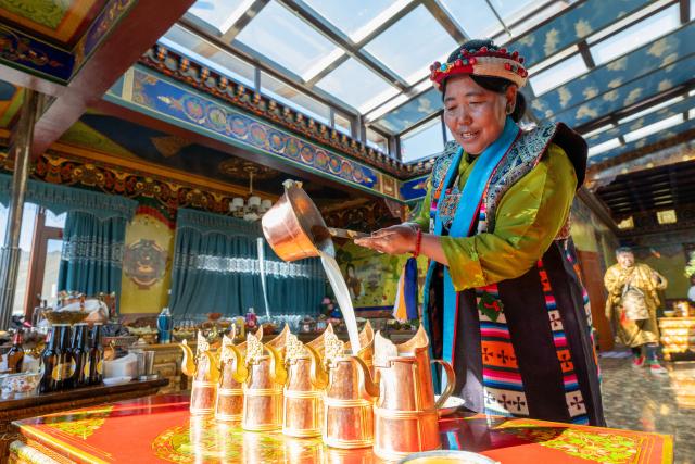 (260121) -- XIGAZE, Jan. 21, 2026 (Xinhua) -- A villager prepares barley wine to celebrate the farmers' New Year in Chusong Village of Nyarixung Township in Xigaze, southwest China's Xizang Autonomous Region, Jan. 20, 2026. Locals in Xigaze celebrate the farmers' New Year on the first day of the twelfth month of the Tibetan calendar. (Photo by Tenzin Norbu/Xinhua)