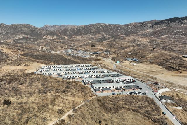 (260121) -- HULUDAO, Jan. 21, 2026 (Xinhua) -- An aerial drone photo shows a view of Zhujiagou Village, Suizhong County, Huludao City, northeast China's Liaoning Province, Jan. 20, 2026. Huludao was severely affected by floods in August 2024, and the low-lying Zhujiagou Village of Suizhong County used to be among the hardest-hit rural areas in the city. The village has undergone a complete transformation thanks to swift post-disaster reconstruction efforts. (Xinhua/Pan Yulong)