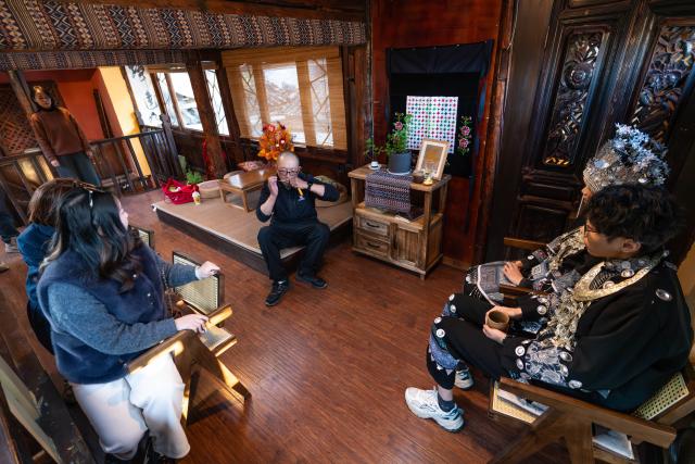 (260121) -- LIJIANG, Jan. 21, 2026 (Xinhua) -- He Dehua (C) performs the Chinese mouth harp at the "Wayfarers" music club at the ancient city of Lijiang, southwest China's Yunnan Province, Jan. 16, 2026. He Dehua, 51, and his wife refurbished an old house of theirs in October 2025, and turned it into a music club called "Wayfarers," where they can share their personal stories with travelers and long-lost friends.
   The name "Wayfarers" came from a CD He had co-produced, drawing inspiration from his memory of watching elders of the family leaving hometown to work for livelihood. "We are all wayfarers in our own life, but we must not forget to search for the truth of life and the true self," said He.
   He has been a career musician for about three decades since he went to learn guitar playing in Beijing in 1997. Back to his hometown in Lijiang, he started to challenge himself by impressing the visitors to this olden city with music, songs and sounds of nature.
   He set out to collect voices and sounds in 2011, and has garnered more than 200 hours of recordings, which included some intangible cultural heritage items, voices in routine life, and melodies performed by folk artists. (Xinhua/Gao Yongwei)