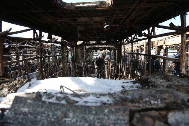 (260121) -- TEHRAN, Jan. 21, 2026 (Xinhua) -- A man stands inside of a destroyed bus during recent unrest in Tehran, Iran, Jan. 21, 2026. Iran's state television IRIB reported on Wednesday that 3,117 people were killed during recent unrest, citing the country's Forensic Medical Organization. (Xinhua/Shadati)