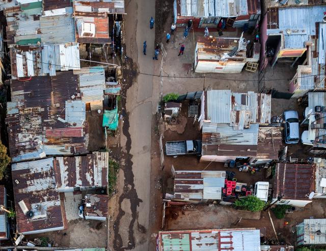 (260121) -- ATTERIDGEVILLE, Jan. 21, 2026 (Xinhua) -- This aerial drone photo taken on Jan. 21, 2026 shows the scene of a shooting incident in Jeffsville, Atteridgeville, Gauteng Province, South Africa. Five people were shot dead on Wednesday outside a tuck shop in Jeffsville, Atteridgeville, in South Africa's Gauteng Province, local police said in a statement. (Photo by Shiraaz Mohamed/Xinhua)