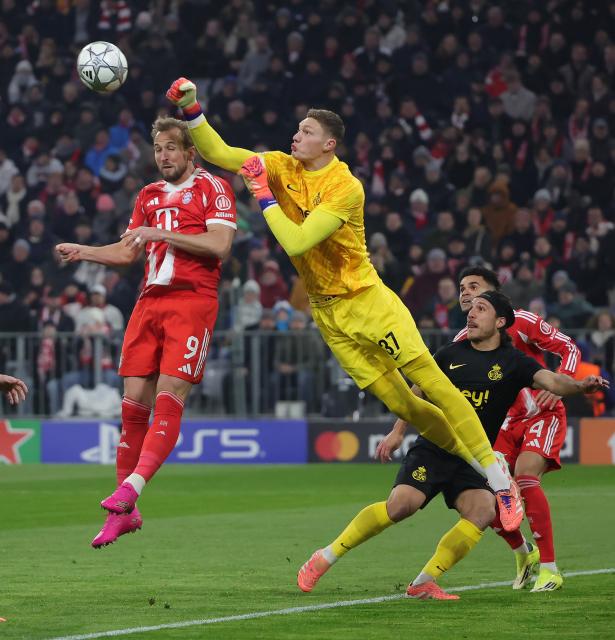 (260122) -- MUNICH, Jan. 22, 2026 (Xinhua) -- Kjell Scherpen (top R), goalkeeper of Union Saint-Gilloise, makes a save against Harry Kane of Bayern Munich during the UEFA Champions League match between Bayern Munich and Union Saint-Gilloise in Munich, Germany, Jan. 21, 2026. (Photo by Philippe Ruiz/Xinhua)