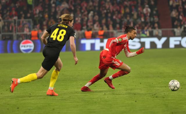 (260122) -- MUNICH, Jan. 22, 2026 (Xinhua) -- Michael Olise (R) of Bayern Munich competes during the UEFA Champions League match between Bayern Munich and Union Saint-Gilloise in Munich, Germany, Jan. 21, 2026. (Photo by Philippe Ruiz/Xinhua)