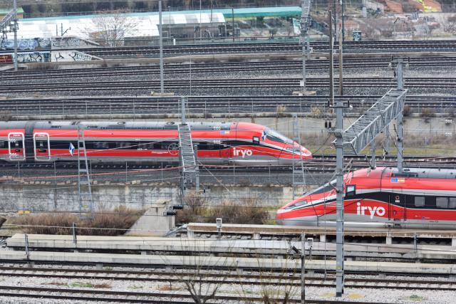 (260122) -- MADRID, Jan. 22, 2026 (Xinhua) -- This photo taken on Jan. 21, 2026 shows two bullet trains passing each other near Atocha Station in Madrid, Spain. Adif, Spain's state-owned railway infrastructure manager, announced on Tuesday that it has imposed temporary speed limits on certain sections of the high-speed railway from Madrid to Barcelona, after train drivers reported bumps along the rail link. (Photo by Gustavo Valiente/Xinhua)