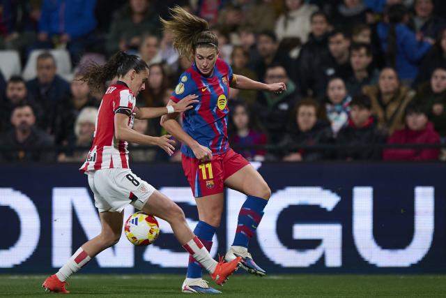 (260122) -- CASTELLON, Jan. 22, 2026 (Xinhua) -- Alexia Putella (R) of Barcelona competes for the ball with Maite Zubieta of Athletic Bilbao during the Spanish Women Super Cup Match between Barcelona and Athletic Bilbao at Castallia Stadium in Castellon , Spain, Jan. 21, 2026. (Photo by Pablo Morano/Xinhua)
