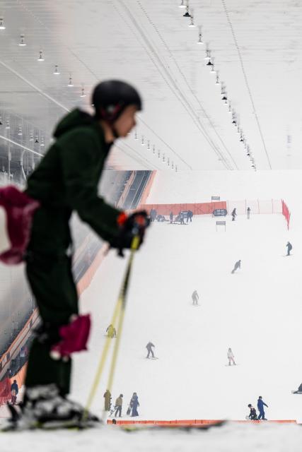 (260122) -- SHENNONGJIA, Jan. 22, 2026 (Xinhua) -- Tourists ski at a ski resort located within a shopping mall in Shennongjia Forestry District, central China's Hubei Province, Jan. 13, 2026. In recent years, Hubei Province has leveraged its strategic location as a transportation hub connecting nine provinces, tapping into its unique ice and snow resources to vigorously develop the ice and snow tourism industry. Multiple locations in Hubei have become well-known ice and snow tourism destinations, attracting numerous tourists to experience the joys of winter sports. (Xinhua/Wu Zhizun)