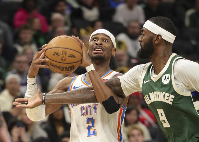 (260122) -- MILWAUKEE, Jan. 22, 2026 (Xinhua) -- Oklahoma City Thunder's Shai Gilgeous-Alexander (L) is fouled by Milwaukee Bucks' Bobby Portis during the 2025-2026 NBA regular season game between Milwaukee Bucks and Oklahoma City Thunder in Milwaukee, the United States, Jan. 21, 2026. (Photo by Joel Lerner/Xinhua)