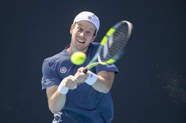 (260122) -- MELBOURNE, Jan. 22, 2026 (Xinhua) -- Botic Van de Zandschulp of the Netherlands hits a return during the men's singles 2nd round match against Shang Juncheng of China at the Australian Open tennis tournament in Melbourne, Australia, Jan. 22, 2026. (Photo by Hu Jingchen/Xinhua)