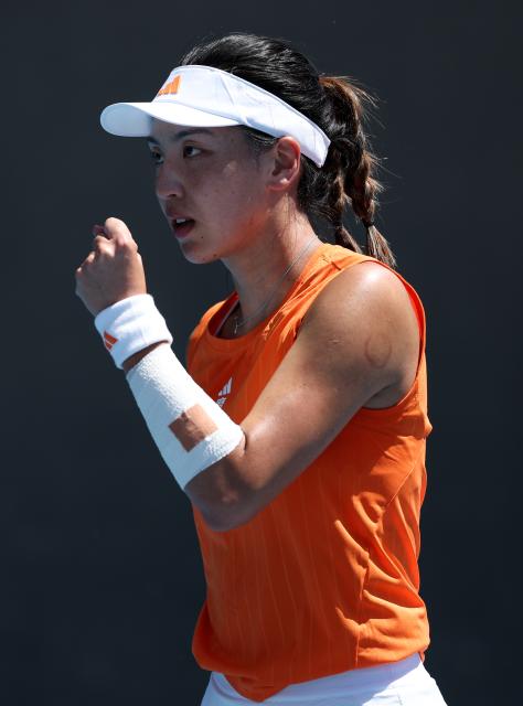 (260122) -- MELBOURNE, Jan. 22, 2026 (Xinhua) -- Wang Xinyu of China reacts during the women's singles 2nd round match against Jelena Ostapenko of Latvia at the Australian Open tennis tournament in Melbourne, Australia, Jan. 22, 2026. (Xinhua/Ma Ping)