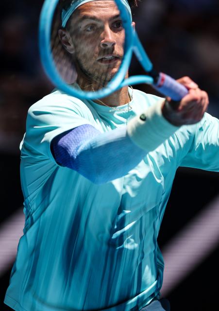 (260122) -- MELBOURNE, Jan. 22, 2026 (Xinhua) -- Lorenzo Musetti of Italy hits a return during the men's singles 2nd round match against Lorenzo Sonego of Italy at the Australian Open tennis tournament in Melbourne, Australia, Jan. 22, 2026. (Xinhua/Ma Ping)