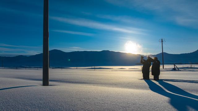 (260122) -- URUMQI, Jan. 22, 2026 (Xinhua) -- Power supply station employees are pictured during a patrol in Turgun Town of Fuyun County in Altay Prefecture, northwest China's Xinjiang Uygur Autonomous Region, on Jan. 16, 2026. A cold wave has swept across the region in recent days, with temperatures in parts of Altay Prefecture dropping to minus 47 degrees Celsius. Amid strong winds and snow, local authorities in charge of transport and energy sectors have coordinated their efforts to ensure uninterrupted heating service and daily supplies for the residents. (Photo by Nurbek Nurman/Xinhua)
