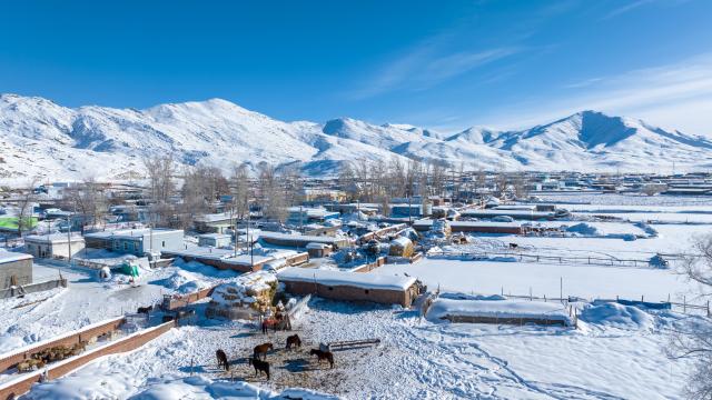 (260122) -- URUMQI, Jan. 22, 2026 (Xinhua) -- An aerial drone photo taken on Jan. 16, 2026 shows a village in Turgun Town of Fuyun County in Altay Prefecture, northwest China's Xinjiang Uygur Autonomous Region. A cold wave has swept across the region in recent days, with temperatures in parts of Altay Prefecture dropping to minus 47 degrees Celsius. Amid strong winds and snow, local authorities in charge of transport and energy sectors have coordinated their efforts to ensure uninterrupted heating service and daily supplies for the residents. (Photo by Nurbek Nurman/Xinhua)