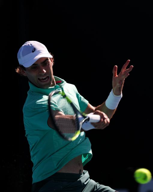 (260122) -- MELBOURNE, Jan. 22, 2026 (Xinhua) -- Eliot Spizzirri hits a return during the men's singles 2nd round match between Wu Yibing of China and Eliot Spizzirri of the United States at the Australian Open tennis tournament in Melbourne, Australia, Jan. 22, 2026. (Xinhua/Ma Ping)