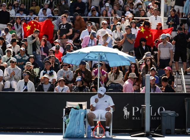 (260122) -- MELBOURNE, Jan. 22, 2026 (Xinhua) -- Wu Yibing celebrates during the men's singles 2nd round match between Wu Yibing of China and Eliot Spizzirri of the United States at the Australian Open tennis tournament in Melbourne, Australia, Jan. 22, 2026. (Xinhua/Ma Ping)