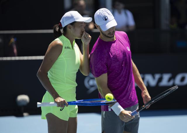 (260122) -- MELBOURNE, Jan. 22, 2026 (Xinhua) -- Zhang Shuai (L)/Tim Puetz communicate during the mixed doubles 1st round match between Zhang Shuai (China)/Tim Puetz (Germany) and Nicole Melichar-Martinez (the United States)/Yuki Bhambri (India) at the Australian Open tennis tournament in Melbourne, Australia, Jan. 22, 2026. (Photo by Hu Jingchen/Xinhua)