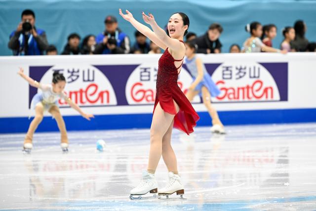 (260122) -- BEIJING, Jan. 22, 2026 (Xinhua) -- Aoki Yuna of Japan reacts after the women's short program at the ISU Four Continents Figure Skating Championships in Beijing, China, Jan. 22, 2026. (Xinhua/Ju Huanzong)