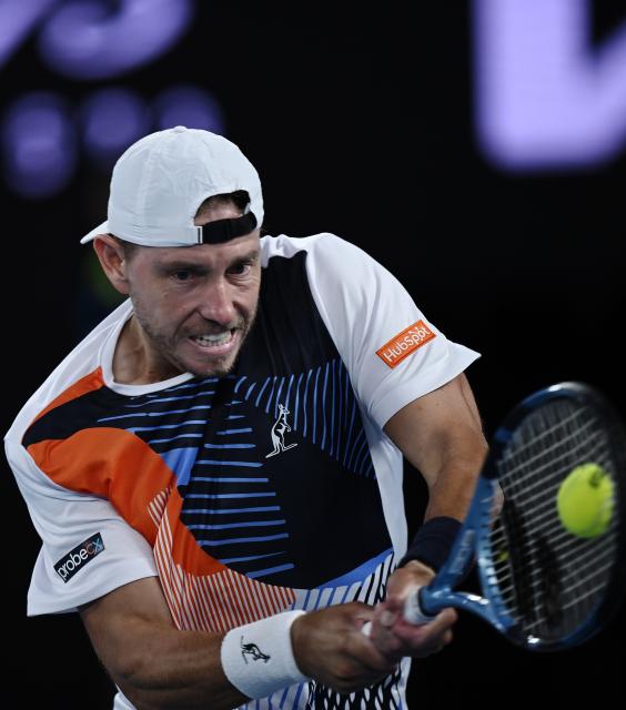 (260122) -- MELBOURNE, Jan. 22, 2026 (Xinhua) -- James Duckworth of Australia hits a return during the men's singles 2nd round match between Jannik Sinner of Italy and James Duckworth of Australia at the Australian Open tennis tournament in Melbourne, Australia, Jan. 22, 2026. (Photo by Wang Shen/Xinhua)
