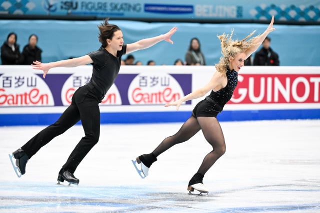 (260122) -- BEIJING, Jan. 22, 2026 (Xinhua) -- Emilea Zingas (R) and Vadym Kolesnik of the United States perform during the ice dance rhythm dance at the ISU Four Continents Figure Skating Championships in Beijing, China, Jan. 22, 2026. (Xinhua/Ju Huanzong)