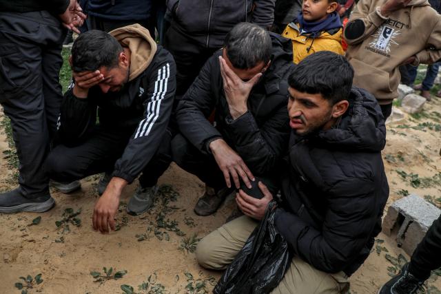 (260122) -- GAZA, Jan. 22, 2026 (Xinhua) -- Mourners attend a funeral of three Palestinian journalists, who were killed by an Israeli airstrike on Wednesday, in the southern Gaza Strip city of Khan Younis, on Jan. 22, 2026. Eleven Palestinians were killed by Israeli fire on Wednesday across Gaza amid escalating tensions, according to Palestinian sources. (Photo by Rizek Abdeljawad/Xinhua)