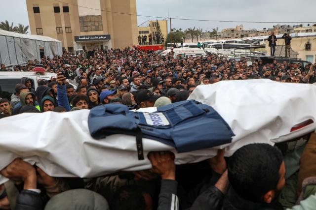 (260122) -- GAZA, Jan. 22, 2026 (Xinhua) -- Mourners attend a funeral of three Palestinian journalists, who were killed by an Israeli airstrike on Wednesday, in the southern Gaza Strip city of Khan Younis, on Jan. 22, 2026. Eleven Palestinians were killed by Israeli fire on Wednesday across Gaza amid escalating tensions, according to Palestinian sources. (Photo by Rizek Abdeljawad/Xinhua)