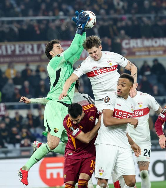 (260123) -- ROME, Jan. 23, 2026 (Xinhua) -- Roma's goalkeeper Mile Svilar (Top L) blocks during the UEFA Europa League 2025/26 league phase match between Roma and Stuttgart of the UEFA Europa League in Rome, Italy, Jan. 22, 2026. (Xinhua/Li Jing)