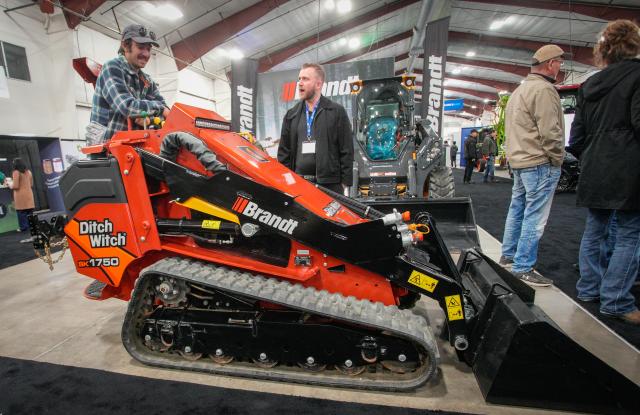 (260123) -- ABBOTSFORD, Jan. 23, 2026 (Xinhua) -- People look at a compact utility loader at the 2026 Pacific Agriculture Show in Abbotsford, British Columbia, Canada, Jan. 22, 2026. The event kicked off here on Thursday and runs until Jan. 24. (Photo by Liang Sen/Xinhua)