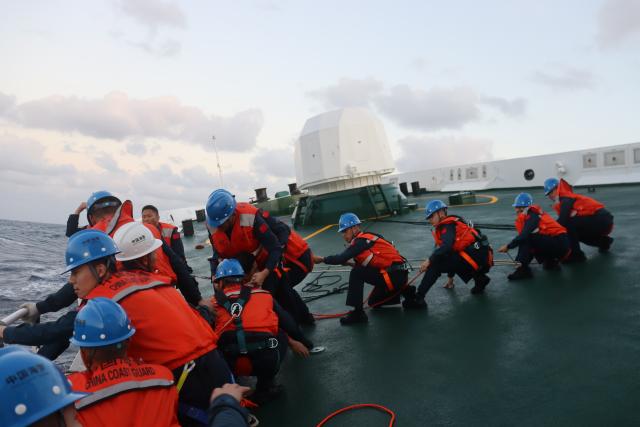 (260123) -- HUANGYAN DAO, Jan. 23, 2026 (Xinhua) -- Members of the China Coast Guard carry out a rescue operation after a foreign cargo ship capsized in the territorial waters of south China's Huangyan Dao, Jan. 23, 2026. China Coast Guard (CCG) has saved 13 Filipino crew members from a shipwreck in the South China Sea, the CCG said on Friday.
   In the early hours of Friday, the CCG received a report that a foreign cargo ship capsized 55 nautical miles northwest of China's Huangyan Dao, with 21 Filipino crew members on board.
   Upon receiving the report, the CCG dispatched two vessels to conduct rescue operations.
   The rescue efforts are still underway, the CCG added. (China Coast Guard/Handout via Xinhua)