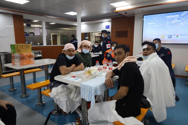 (260123) -- HUANGYAN DAO, Jan. 23, 2026 (Xinhua) -- Rescued Filipino crew members are pictured after a foreign cargo ship capsized in the territorial waters of south China's Huangyan Dao, Jan. 23, 2026. China Coast Guard (CCG) has saved 13 Filipino crew members from a shipwreck in the South China Sea, the CCG said on Friday.
   In the early hours of Friday, the CCG received a report that a foreign cargo ship capsized 55 nautical miles northwest of China's Huangyan Dao, with 21 Filipino crew members on board.
   Upon receiving the report, the CCG dispatched two vessels to conduct rescue operations.
   The rescue efforts are still underway, the CCG added. (China Coast Guard/Handout via Xinhua)