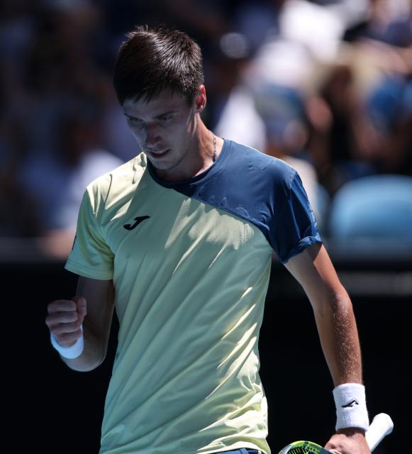 (260123) -- MELBOURNE, Jan. 23, 2026 (Xinhua) -- Fabian Marozsan of Hungary reacts during the men's singles 3rd round match against Daniil Medvedev of Russia at the Australian Open tennis tournament in Melbourne, Australia, Jan. 23, 2026. (Xinhua/Ma Ping)