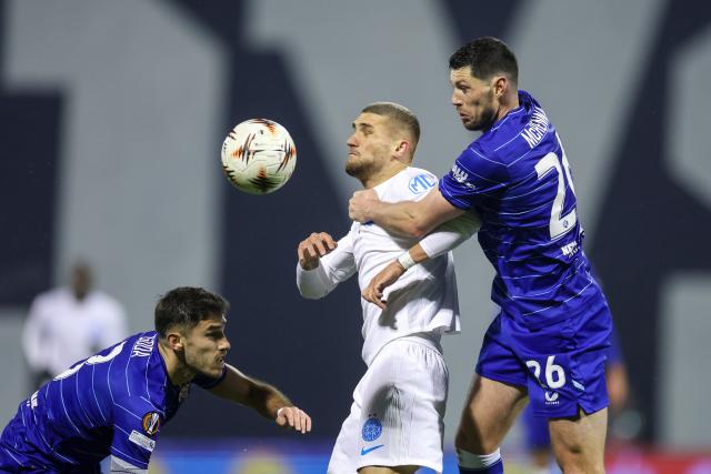 (260123) -- ZAGREB, Jan. 23 (Xinhua) -- Daniel Birligea (C) of FCSB and Scott McKenna (R) of Dinamo compete for the ball during the UEFA Europa League 2025/26 League Phase match between GNK Dinamo and FCSB in Zagreb, Croatia, Jan. 22, 2026. (Photo by Igor Kralj/PIXSELL via Xinhua)