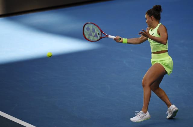 (260122) -- MELBOURNE, Jan. 23, 2026 (Xinhua) -- Jasmine Paolini of Italy hits a return during the women's singles 3rd round match against Iva Jovic of the United States at the Australian Open tennis tournament in Melbourne, Australia, Jan. 23, 2026. (Photo by Wang Shen/Xinhua)
