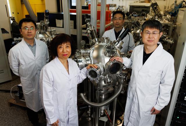 (260123) -- BEIJING, Jan. 23, 2026 (Xinhua) -- Researchers Zhang Qinghua, Jin Kuijuan, Zhong Hai and Ge Chen (from left to right), who have successfully identified one-dimensional charged domain walls within a fluorite-structured ferroelectric material, pose for a group photo at a laboratory of the Institute of Physics at the Chinese Academy of Sciences in Beijing, capital of China, Jan. 21, 2026. Chinese researchers recently made a breakthrough in ferroelectric materials that promises to dramatically increase information storage density. 
   The research team from the Institute of Physics at the Chinese Academy of Sciences, successfully identified one-dimensional charged domain walls within a fluorite-structured ferroelectric material. 
   These walls are tiny, with both thickness and width measuring just a few hundred-thousandths of the diameter of a human hair. This discovery, notably, provides a scientific basis for developing next-generation ultra-high-density devices.
   Their findings were on Friday published in the journal Science. (Xinhua/Jin Liwang)