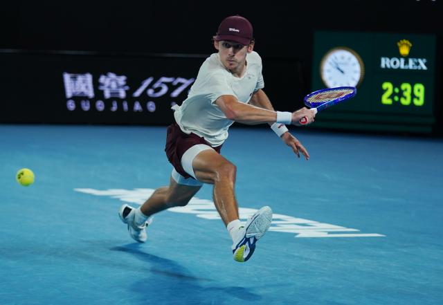 (260123) -- MELBOURNE, Jan. 23, 2026 (Xinhua) -- Alex de Minaur hits a return during the men's singles 3rd round match between Alex de Minaur of Australia and Frances Tiafoe of the United States at the Australian Open tennis tournament in Melbourne, Australia, Jan. 23, 2026. (Photo by Wang Shen/Xinhua)