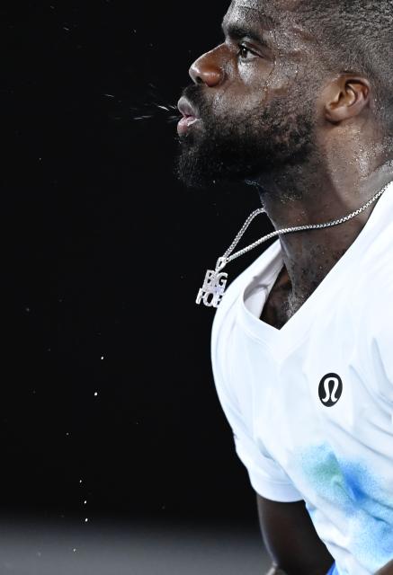 (260123) -- MELBOURNE, Jan. 23, 2026 (Xinhua) -- Frances Tiafoe reacts during the men's singles 3rd round match between Alex de Minaur of Australia and Frances Tiafoe of the United States at the Australian Open tennis tournament in Melbourne, Australia, Jan. 23, 2026. (Photo by Wang Shen/Xinhua)