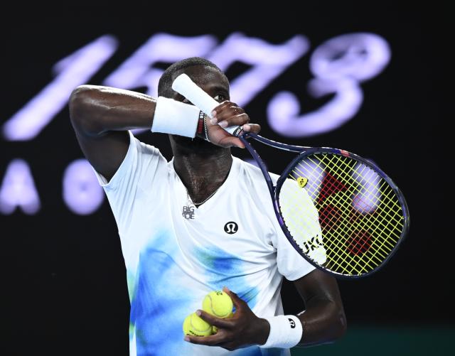 (260123) -- MELBOURNE, Jan. 23, 2026 (Xinhua) -- Frances Tiafoe reacts during the men's singles 3rd round match between Alex de Minaur of Australia and Frances Tiafoe of the United States at the Australian Open tennis tournament in Melbourne, Australia, Jan. 23, 2026. (Photo by Wang Shen/Xinhua)