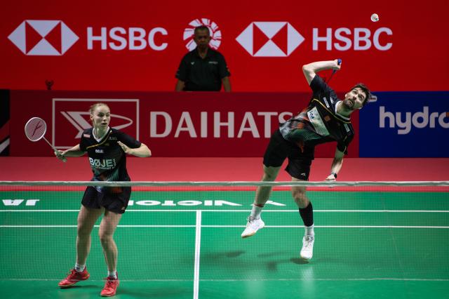 (260123) -- JAKARTA, Jan. 23, 2026 (Xinhua) -- Mathias Christiansen/Alexandra Boje (L) of Denmark compete during the mixed doubles quarterfinal match between Guo Xinwa/Chen Fanghui of China and Mathias Christiansen/Alexandra Boje of Denmark at the Indonesia Masters 2026 badminton tournament in Jakarta, Indonesia, Jan. 23, 2026. (Xinhua/Veri Sanovri)