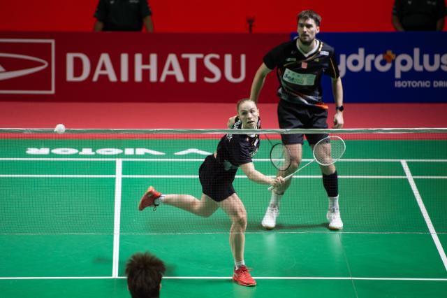 (260123) -- JAKARTA, Jan. 23, 2026 (Xinhua) -- Mathias Christiansen/Alexandra Boje (L) of Denmark compete during the mixed doubles quarterfinal match between Guo Xinwa/Chen Fanghui of China and Mathias Christiansen/Alexandra Boje of Denmark at the Indonesia Masters 2026 badminton tournament in Jakarta, Indonesia, Jan. 23, 2026. (Xinhua/Veri Sanovri)