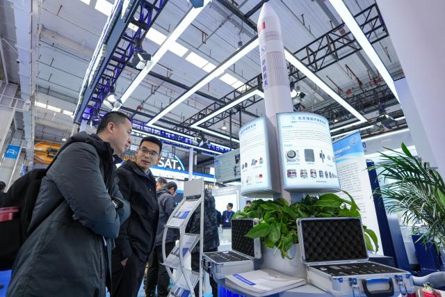 (260123) -- BEIJING, Jan. 23, 2026 (Xinhua) -- People visit the booth of Beijing Institute of Structure and Environment Engineering at the 2026 Beijing International Commercial Space Exhibition in Beijing, capital of China, Jan. 23, 2026. The exhibition kicked off here on Friday. (Xinhua/Ju Huanzong)