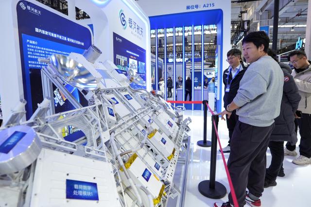 (260123) -- BEIJING, Jan. 23, 2026 (Xinhua) -- People visit the model of Lingxi-03 satellite at the 2026 Beijing International Commercial Space Exhibition in Beijing, capital of China, Jan. 23, 2026. The exhibition kicked off here on Friday. (Xinhua/Ju Huanzong)