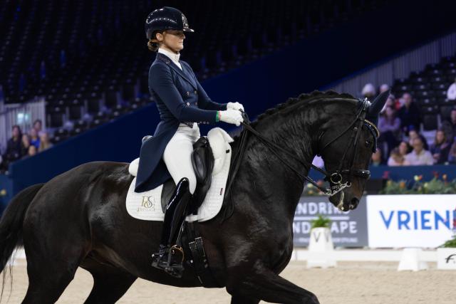 (260124) -- AMSTERDAM, Jan. 24, 2026 (Xinhua) -- Marieke van de Putten of the Netherlands rides her horse during the Federation Equestre International (FEI) Dressage World Cup at Jumping Amsterdam 2026 in Amsterdam, the Netherlands, Jan. 23, 2026. The 65th edition of Jumping Amsterdam, one of Europe's premier equestrian events, took place from Jan. 22 to 25 at the RAI Amsterdam Convention Centre. (Photo by Sylvia Lederer/Xinhua)