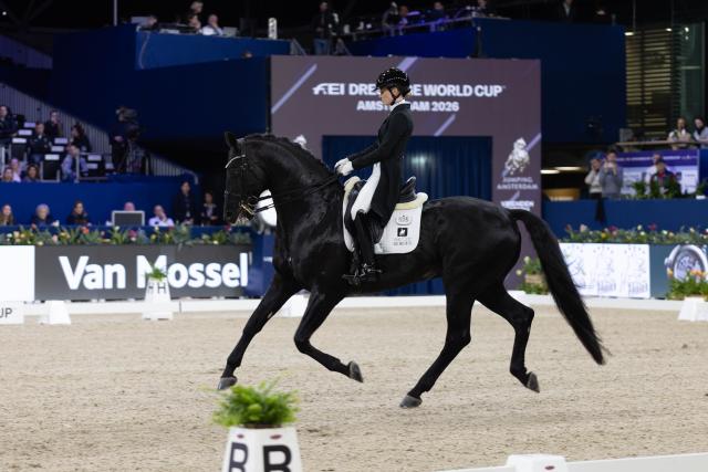 (260124) -- AMSTERDAM, Jan. 24, 2026 (Xinhua) -- Charlotte Fry of Britain rides her horse during the Federation Equestre International (FEI) Dressage World Cup at Jumping Amsterdam 2026 in Amsterdam, the Netherlands, Jan. 23, 2026. The 65th edition of Jumping Amsterdam, one of Europe's premier equestrian events, took place from Jan. 22 to 25 at the RAI Amsterdam Convention Centre. (Photo by Sylvia Lederer/Xinhua)