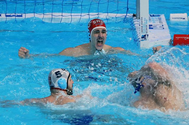 (260124) -- BELGRADE, Jan. 24, 2026 (Xinhua) -- Serbia's goalkeeper Milan Glusac (top) celebrates victory after the semi-final between Serbia and Italy at the Men's European Water Polo Championships in Belgrade, Serbia, Jan. 23, 2026. (Photo by Predrag Milosavljevic/Xinhua)
