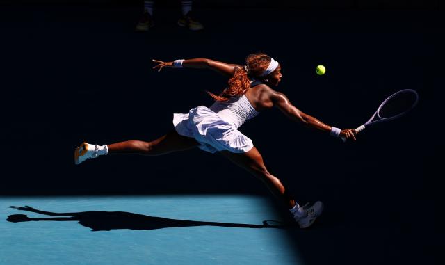 (260124) -- BEIJING, Jan. 24, 2026 (Xinhua) -- Coco Gauff of the United States hits a return during the women's singles 3rd round match against Hailey Baptiste of the United States at the Australian Open tennis tournament in Melbourne, Australia, Jan. 23, 2026. (Xinhua/Ma Ping)