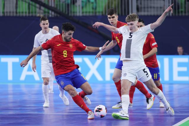 (260124) -- LJUBLJANA, Jan. 24, 2026 (Xinhua) -- Adolfo (front L) of Spain vies with Luka Cop (front R) of Slovenia during the UEFA Futsal EURO 2026 match between Slovenia and Spain at Arena Stozice, Ljubljana, Slovenia, Jan. 23, 2026. (Photo by Zeljko Stevanic/Xinhua)