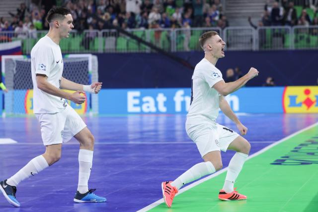 (260124) -- LJUBLJANA, Jan. 24, 2026 (Xinhua) -- Matej Fidersek (R) of Slovenia celebrates his goal during the UEFA Futsal EURO 2026 match between Slovenia and Spain at Arena Stozice, Ljubljana, Slovenia, Jan. 23, 2026. (Photo by Zeljko Stevanic/Xinhua)