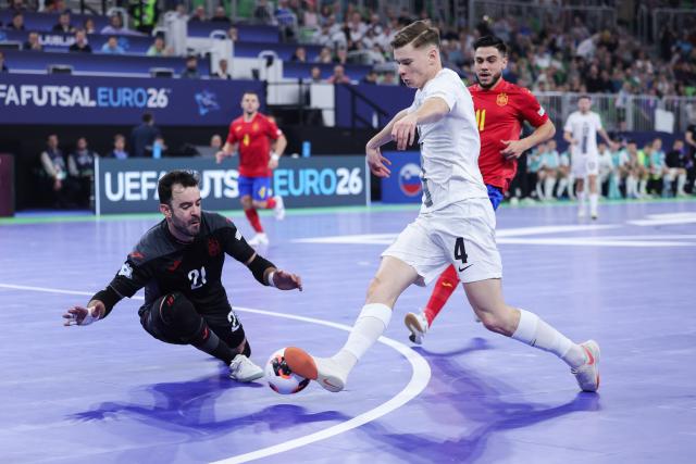 (260124) -- LJUBLJANA, Jan. 24, 2026 (Xinhua) -- Jure Suban (front R) of Slovenia competes against Didac Plana, goalkeeper of Spain, during the UEFA Futsal EURO 2026 match between Slovenia and Spain at Arena Stozice, Ljubljana, Slovenia, Jan. 23, 2026. (Photo by Zeljko Stevanic/Xinhua)