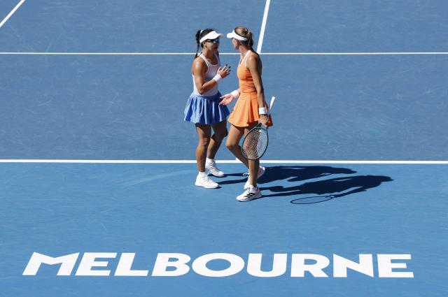 (260124) -- MELBOURNE, Jan. 24, 2026 (Xinhua) -- Guo Hanyu (L)/Kristina Mladenovic react during the women's doubles 2nd round match between Guo Hanyu (China)/Kristina Mladenovic (France) and Clara Tauson (Denmark)/Anastasia Pavlyuchenkova (Russia) at the Australian Open tennis tournament in Melbourne, Australia, Jan. 24, 2026. (Xinhua/Ma Ping)