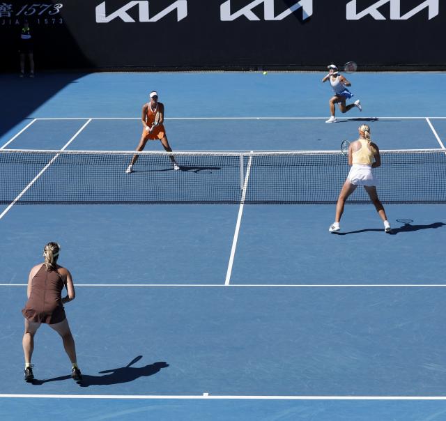 (260124) -- MELBOURNE, Jan. 24, 2026 (Xinhua) -- Guo Hanyu (R, Top)/Kristina Mladenovic compete during the women's doubles 2nd round match between Guo Hanyu (China)/Kristina Mladenovic (France) and Clara Tauson (Denmark)/Anastasia Pavlyuchenkova (Russia) at the Australian Open tennis tournament in Melbourne, Australia, Jan. 24, 2026. (Xinhua/Ma Ping)